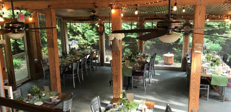 Cafe Azafran's pop-up paella feasts are held in the garden dining room surrounded by greenery and seasonal flowers. It's fun to stand and watch Rich work his magic in that huge paella skillet. BOB YESBEK PHOTO